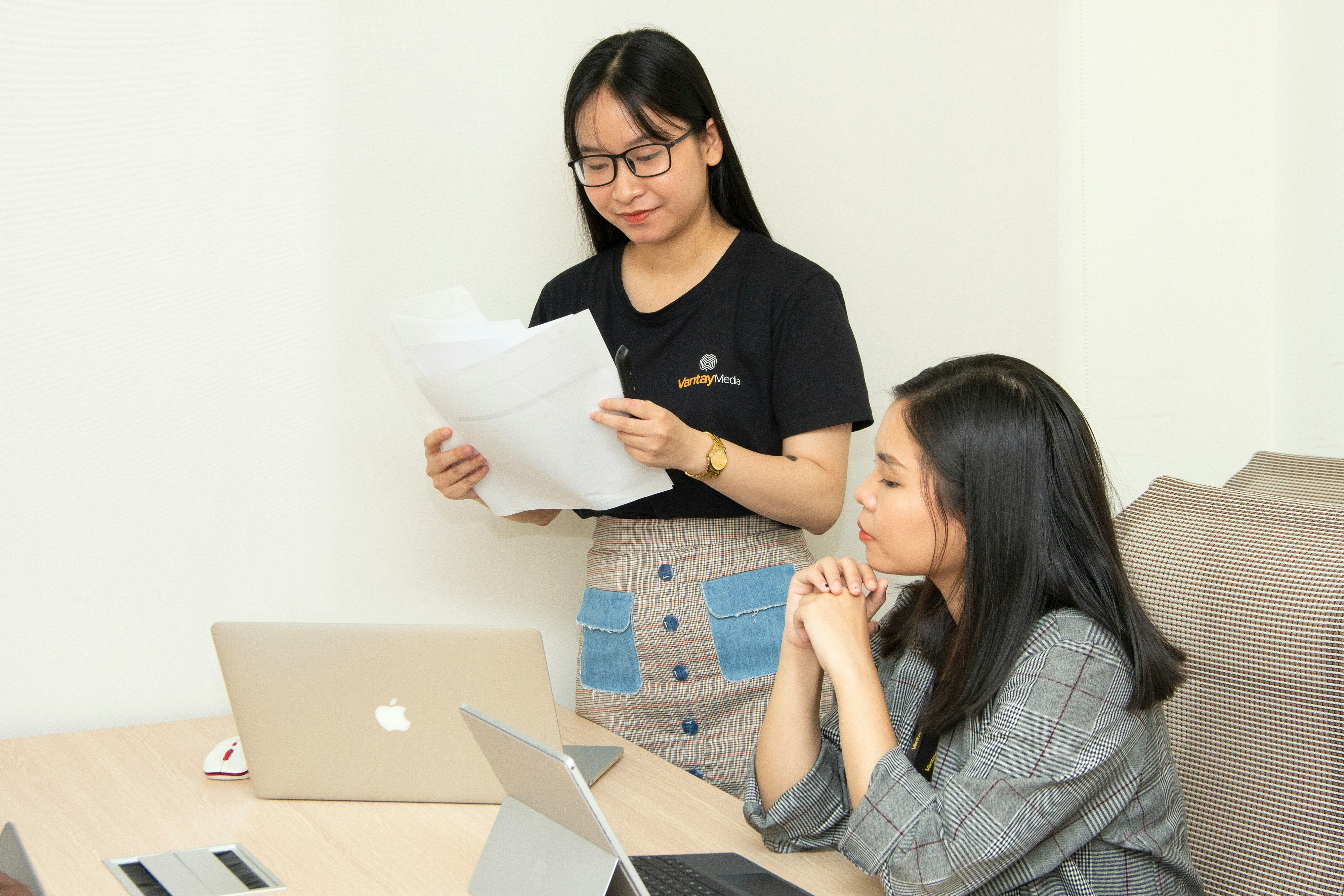 SJS Business Solutions team reviewing client documents